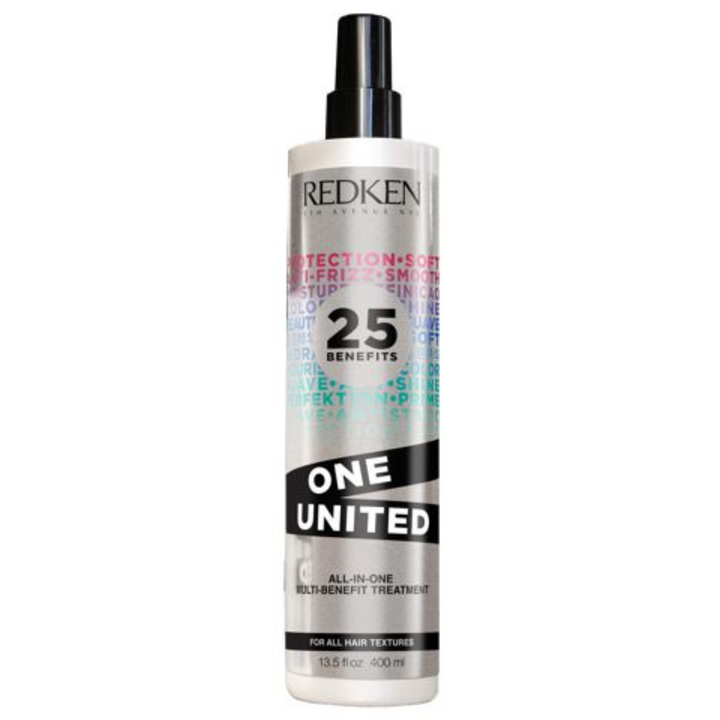 Bouteille spray REDKEN One United traitement multi-bénéfices 400 ml blanche avec pompe noire et étiquette multicolore sur fond blanc.