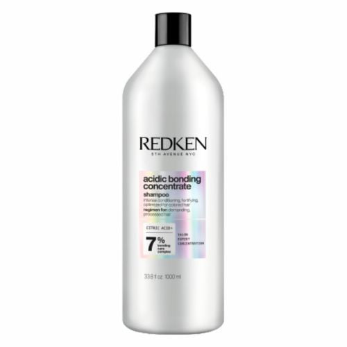 Bouteille REDKEN Acidic Bonding Concentrate shampoing 1000 ml grise avec étiquette pour cheveux abîmés sur fond blanc.