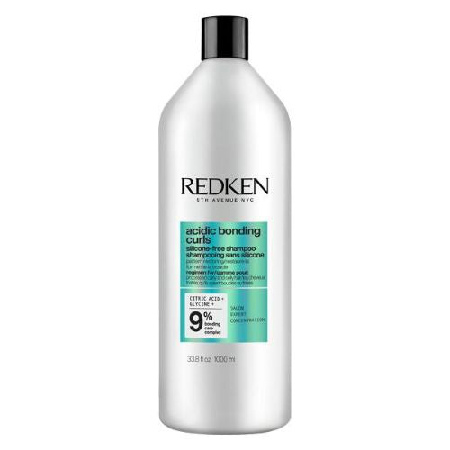 Bouteille REDKEN Acidic Bonding Curls shampoing 1000 ml grise avec étiquette turquoise pour cheveux bouclés.