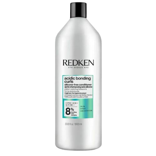 Bouteille REDKEN Acidic Bonding Curls après-shampoing 1000 ml grise  clair avec étiquette turquoise pour cheveux bouclés.