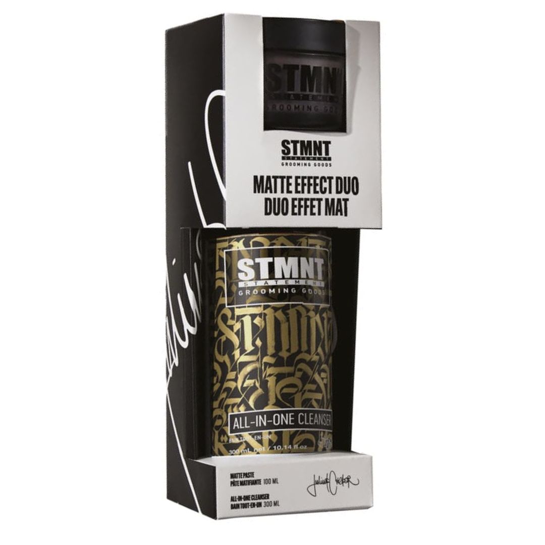 Duo STMNT comprenant un bain tout-en-un nettoyant et une pâte matifiante coiffante à finition ultra mate pour cheveux et barbe sur fond neutre.