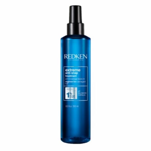 Flacon bleu métallique REDKEN Extreme Anti-Snap 250 ml avec vaporisateur noir, traitement sans rinçage pour cheveux abîmés et cassants, fond blanc.