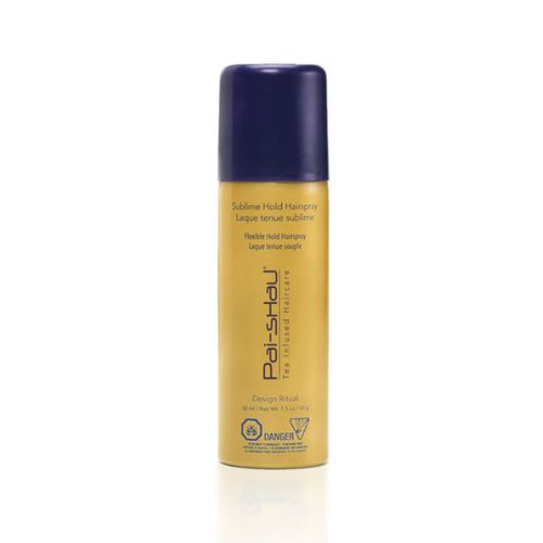 Mini spray coiffant Pai-Shau Laque Tenue Sublime format voyage 50 ml, flacon doré mat avec bouchon violet foncé, sur fond blanc. Spray coiffure souple, thermo-protecteur et anti-frisottis.