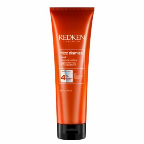 Tube orange REDKEN Frizz Dismiss masque lissant 250 ml avec bouchon noir, soin anti-frisottis hydratant pour cheveux indisciplinés, fond blanc.