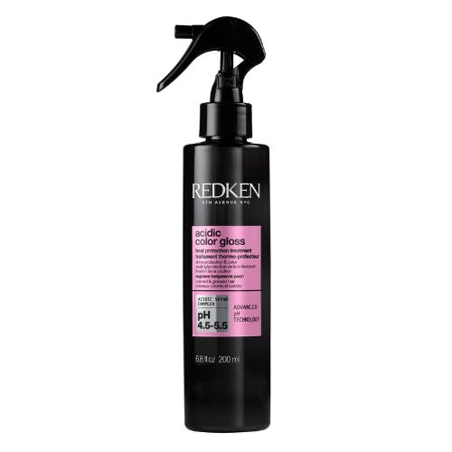 Flacon spray REDKEN Acidic Color Gloss 200 ml noir avec pulvérisateur et étiquette rose, traitement brillance sans rinçage pour cheveux colorés sur fond blanc.