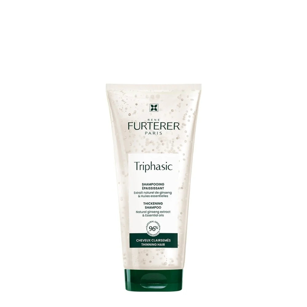 Flacon tube shampoing René Furterer Triphasic transparent avec micro-billes visibles, capuchon vert foncé, présenté sur fond blanc propre