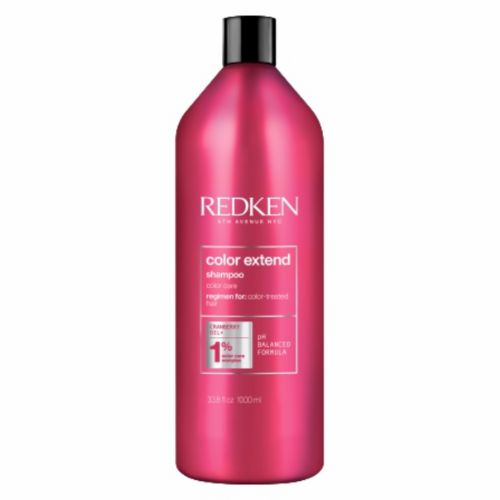Shampooing Redken Color Extend format 1 litre  en bouteille rouge, soin protecteur pour cheveux colorés, préserve la brillance et l’éclat de la couleur, fond blanc.