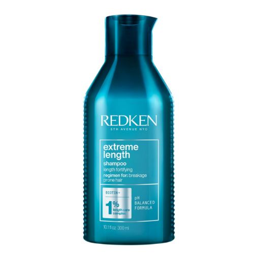 Shampooing Redken Extreme Length format de 300 ml en bouteille turquoise, soin à la biotine pour favoriser la pousse des cheveux et réduire la casse, fond blanc.