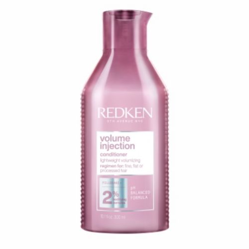 Bouteille rose métallique REDKEN Volume Injection après-shampoing volumisant 300 ml avec bouchon flip-top, soin pour cheveux fins sans volume, fond blanc.