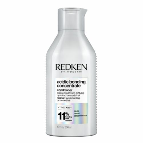 Flacon REDKEN Acidic Bonding Concentrate après-shampoing 300 ml gris clair avec étiquette pour cheveux abîmés sur fond blanc.
