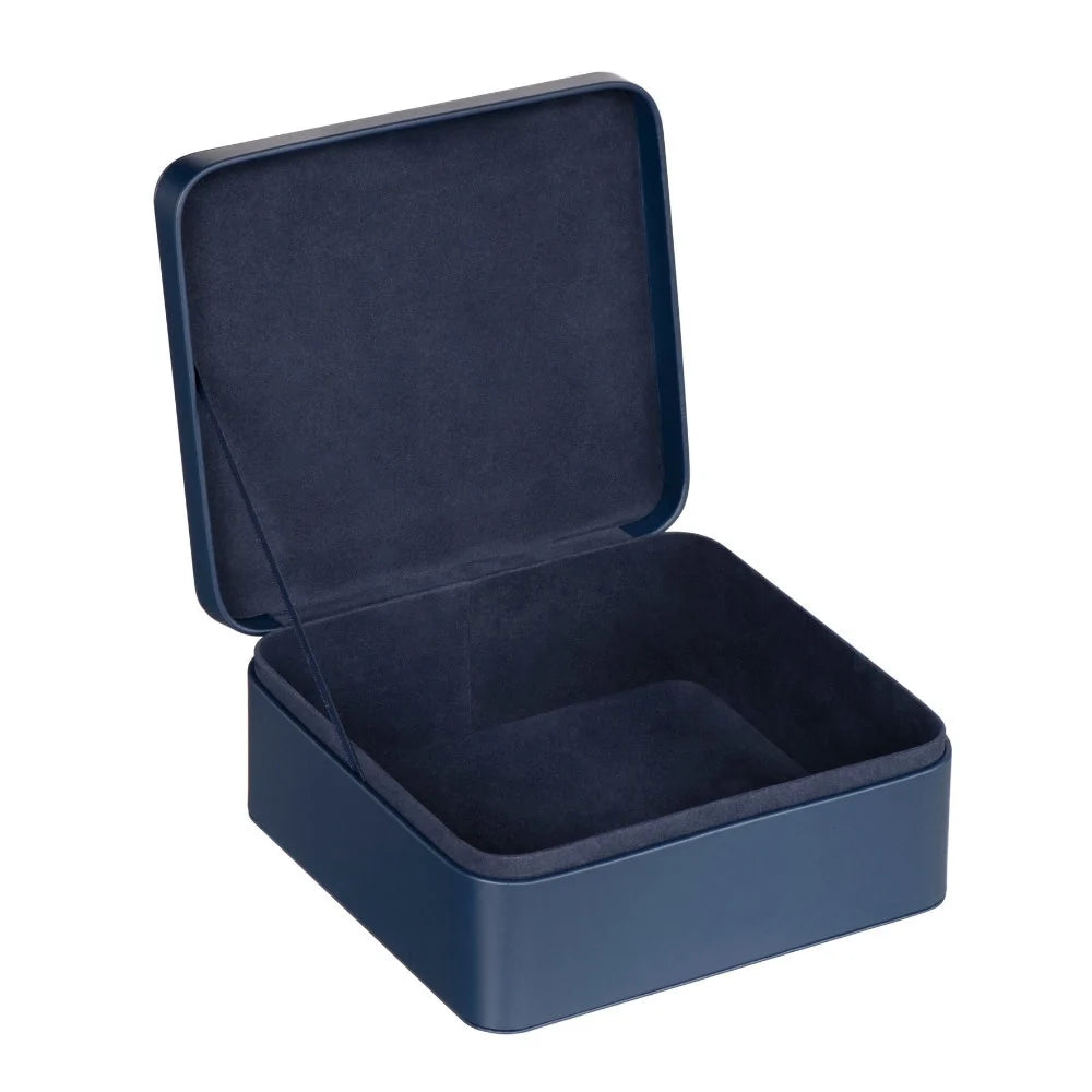 Coffret Moroccanoil bleu marine ouvert avec intérieur doux bleu foncé, présenté seul sur fond blanc.