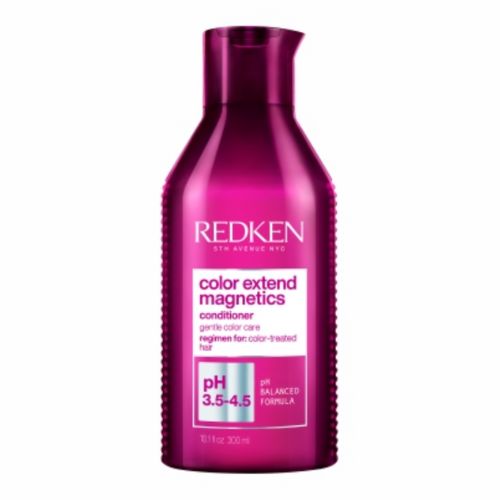 Flacon REDKEN Color Extend Magnetics après-shampoing 300 ml rose fuchsia avec bouchon assorti pour cheveux colorés sur fond blanc.