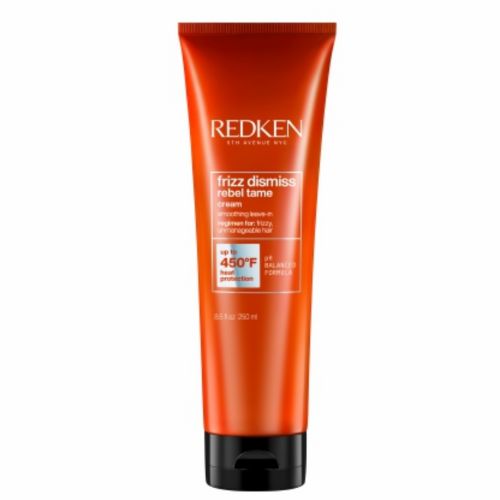 Tube REDKEN Frizz Dismiss crème lissante sans rinçage 250 ml orange avec bouchon noir pour contrôler les frisottis sur fond blanc.