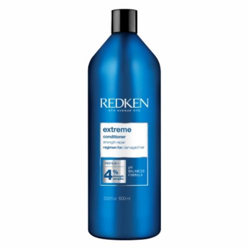 Grande bouteille bleue métallique REDKEN Extreme après-shampoing fortifiant 1 litre avec bouchon noir, format professionnel pour cheveux fragilisés, fond blanc.