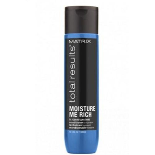 Bouteille noire et bleue de 300 ml du revitalisant Moisture Me Rich de Matrix, conçu pour hydrater et adoucir les cheveux secs ou colorés grâce à la glycérine et l’huile de noyau d’abricot