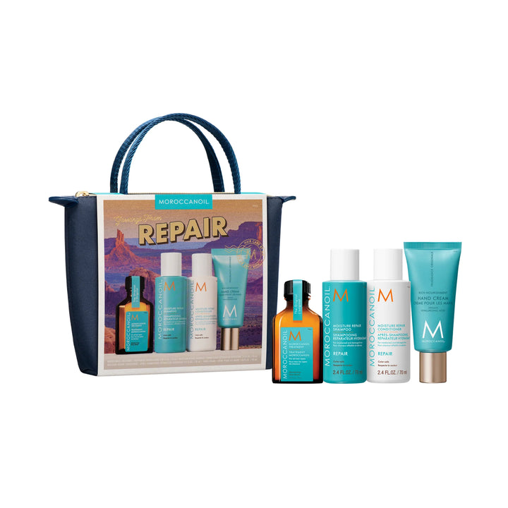 Produits Moroccanoil Repair alignés devant une pochette bleu marin sur fond blanc.