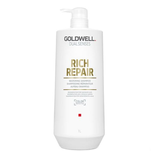 Shampooing Goldwell Dualsenses Rich Repair en format 1 litre avec pompe. Flacon blanc professionnel avec inscriptions dorées, conçu pour cheveux abîmés.