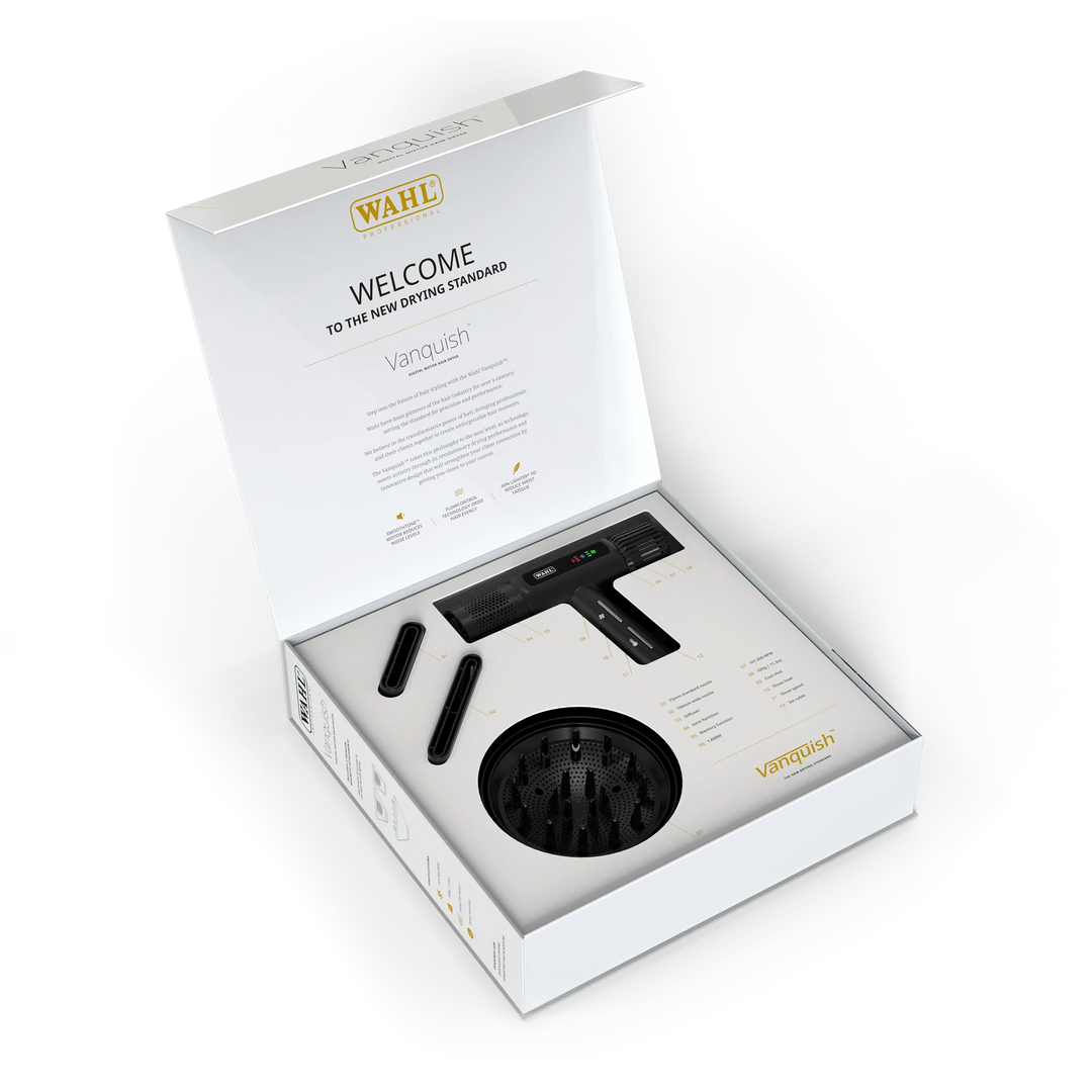 Coffret ouvert du séchoir professionnel WAHL Vanquish avec accessoires inclus, embouts concentrateurs et diffuseur noir, présentation haut de gamme sur fond blanc.