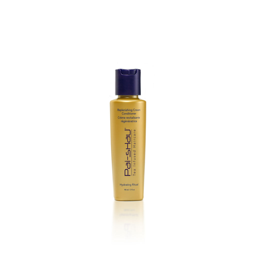 Flacon doré mat de 90 ml du Revitalisant Régénérateur Pai-Shau avec bouchon violet foncé. Crème revitalisante végétalienne hydratante au thé infusé, format voyage.